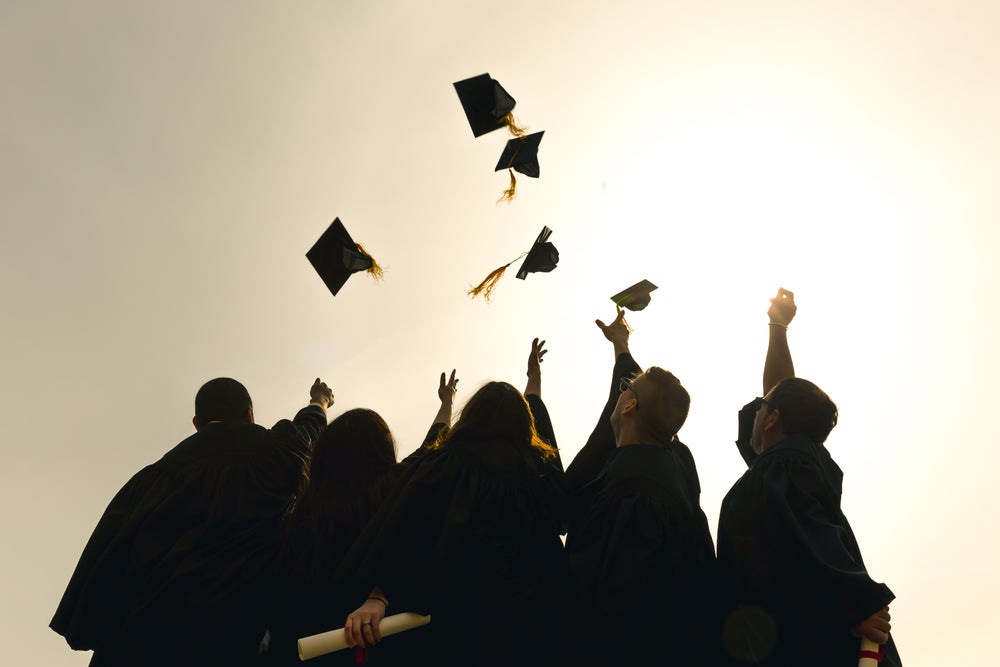 grad-students-throwing-hats-in-the-air